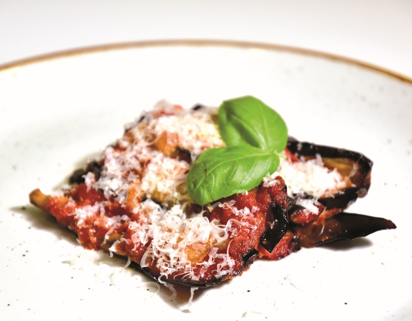 La Parmigiana – Baked aubergine layered with tomato sauce and mozzarella