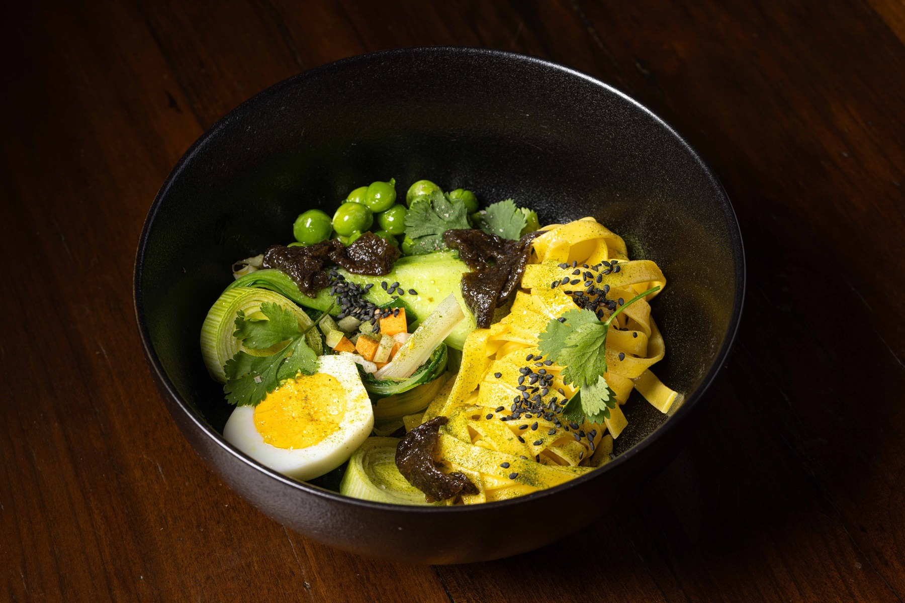 Italian ramen:  egg pasta, tomato broth, eggs and vegetables